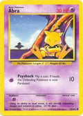 Pokémon trading card featuring Abra with a yellow and purple design.
