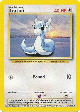 Pokémon Dratini trading card with a sunset over water background