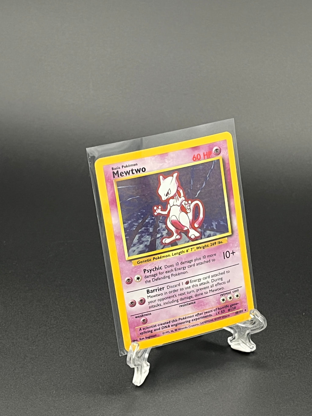 Trading card in a protective clear sleeve on a dark background