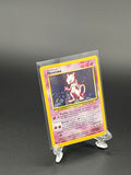 Trading card in a protective clear sleeve on a dark background