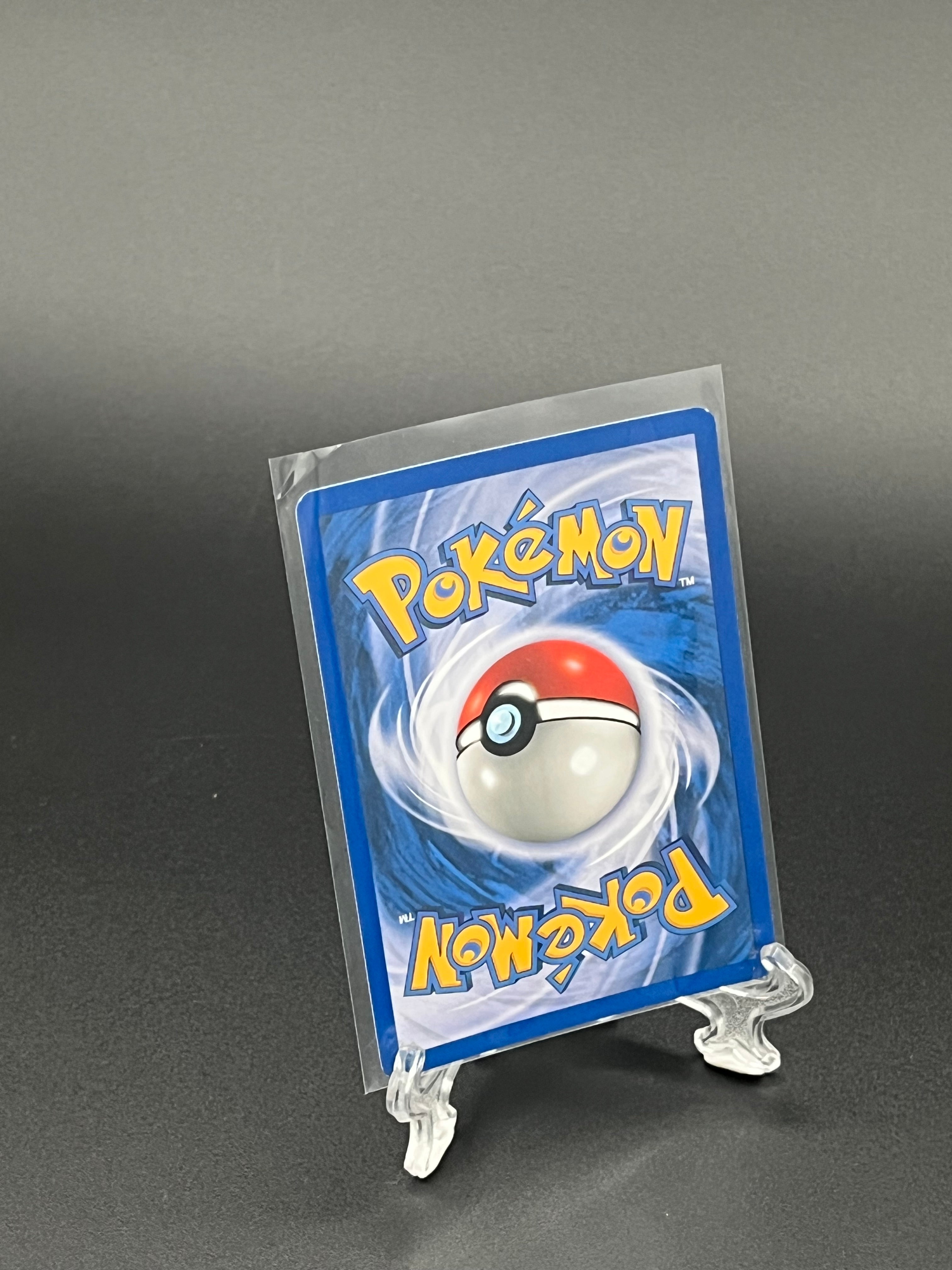 Pokémon trading card in clear packaging on a dark background