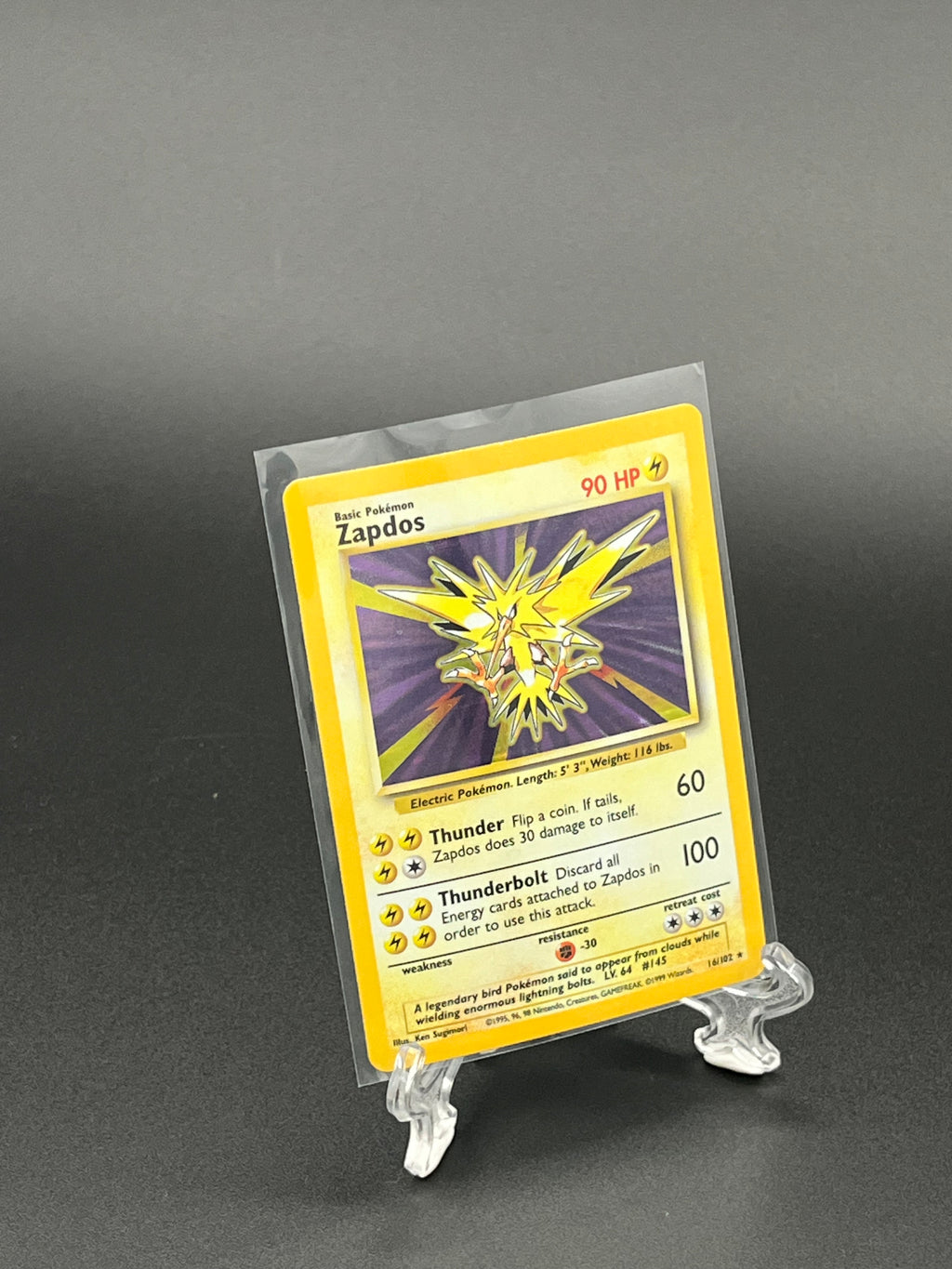 Trading card in a protective sleeve on a dark background