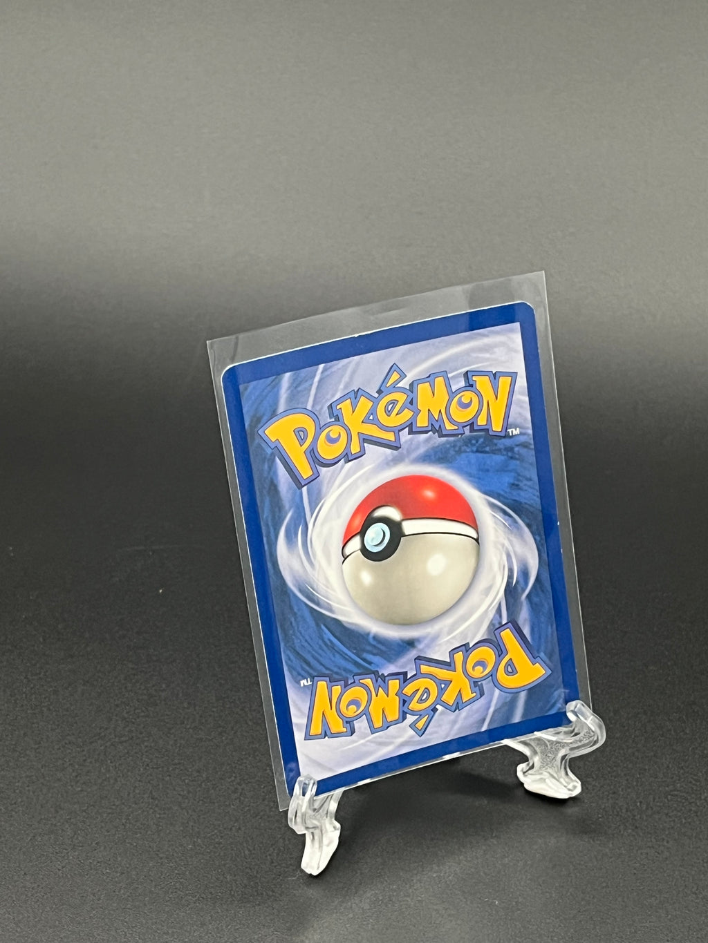 Pokémon trading card in a clear protective sleeve on a dark background