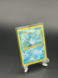 Trading card in a clear protective sleeve on a dark background