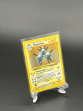 Pokémon trading card in a clear protective sleeve on a dark background