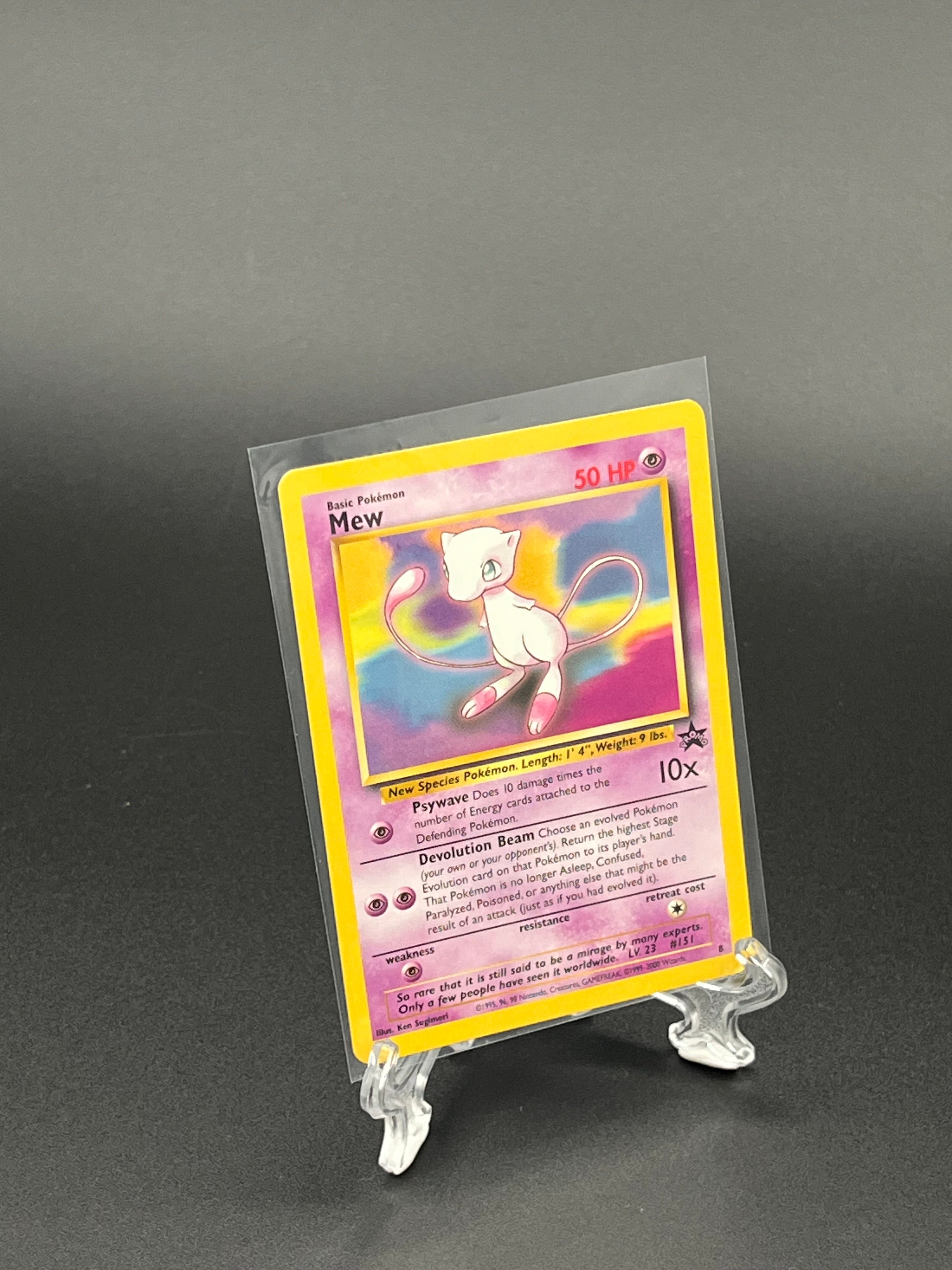 Trading card in a clear protective sleeve on a dark background