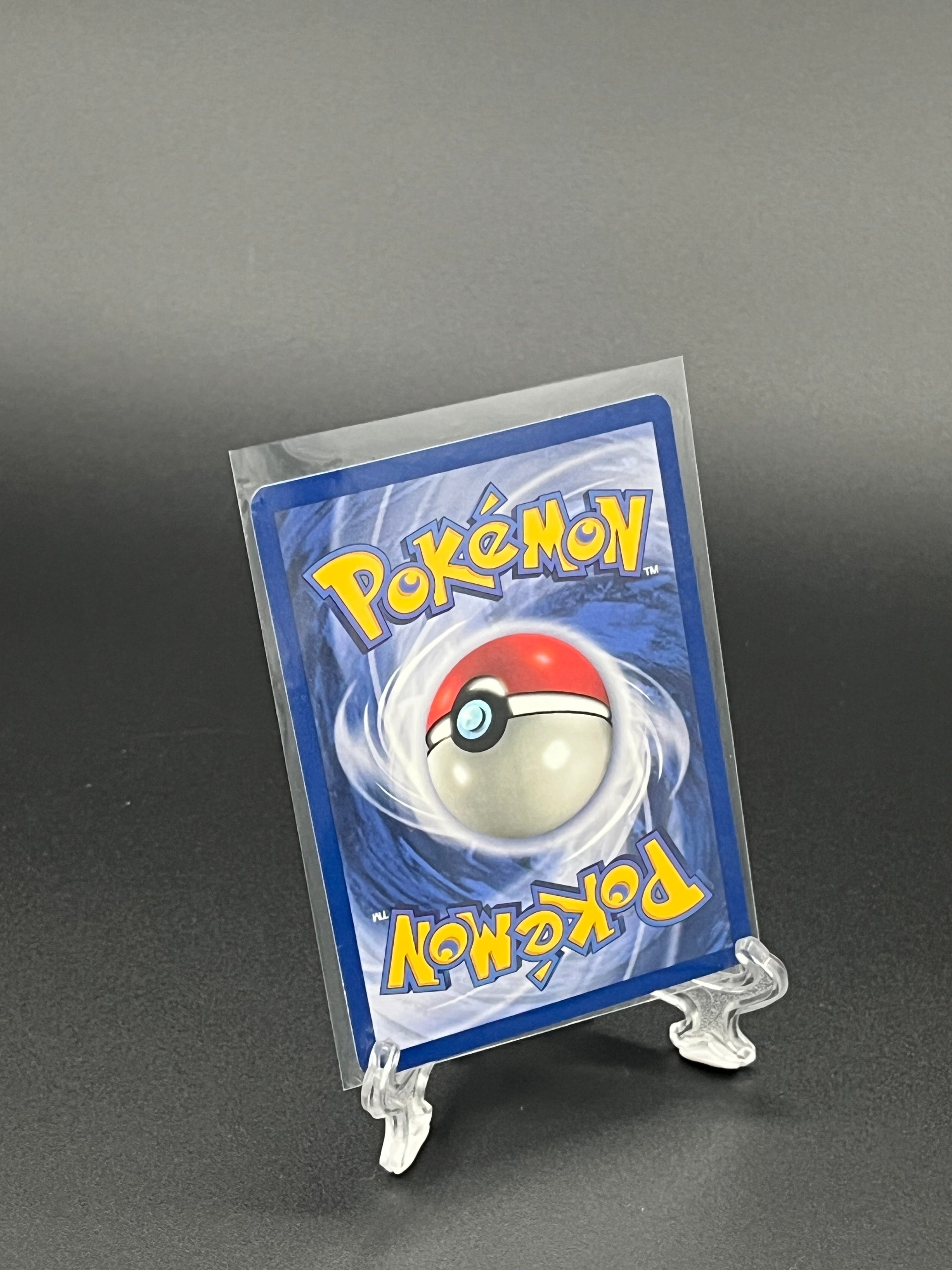 Pokémon trading card in clear packaging on a dark background
