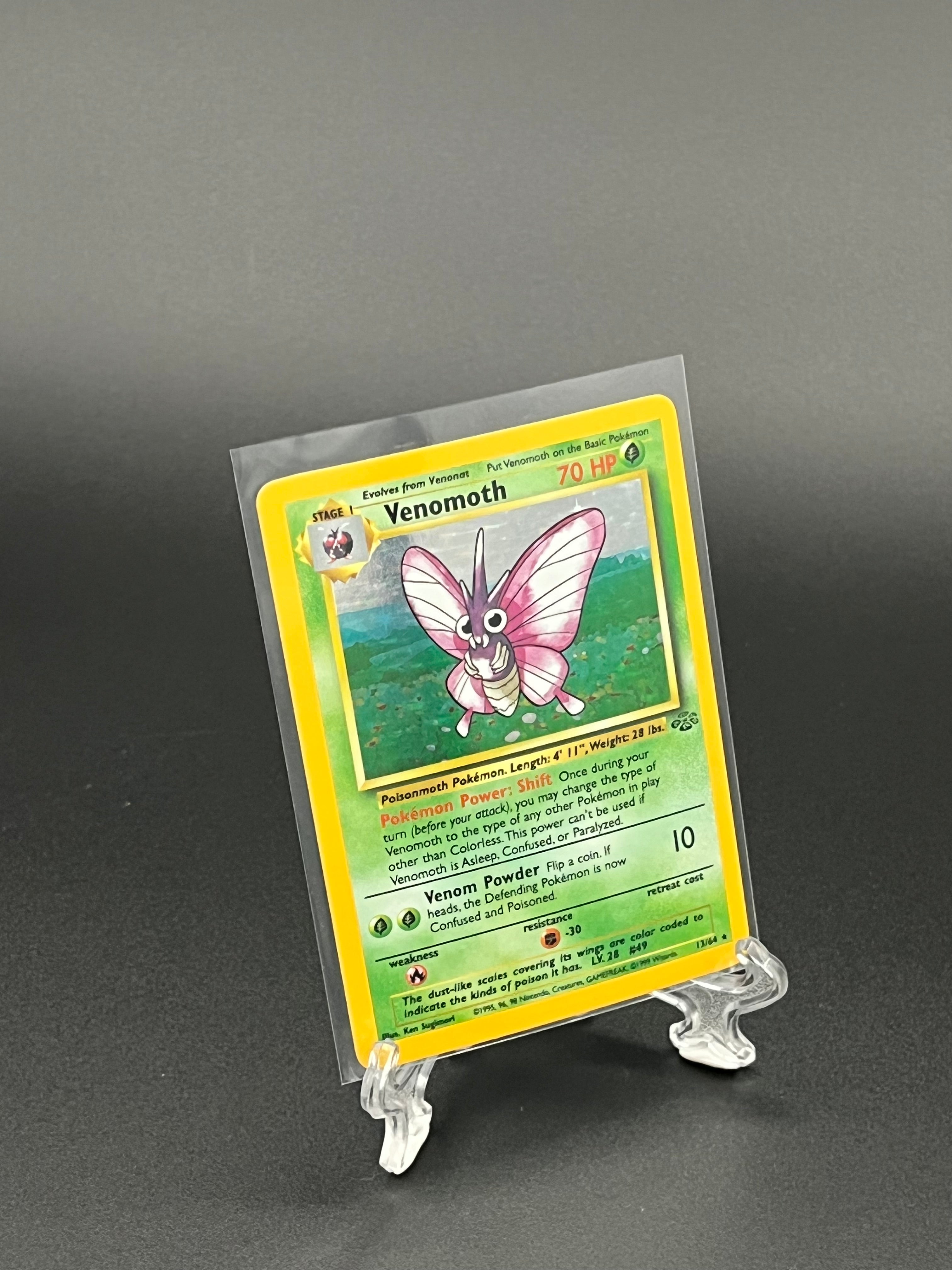 Pokémon trading card in a clear protective holder on a dark background