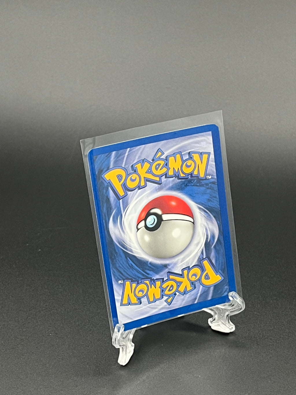 Pokémon trading card in clear protective holder on a dark background
