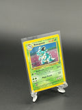 Pokémon trading card in a clear protective sleeve on a dark background