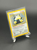 Pokémon trading card in a clear protective holder on a dark background