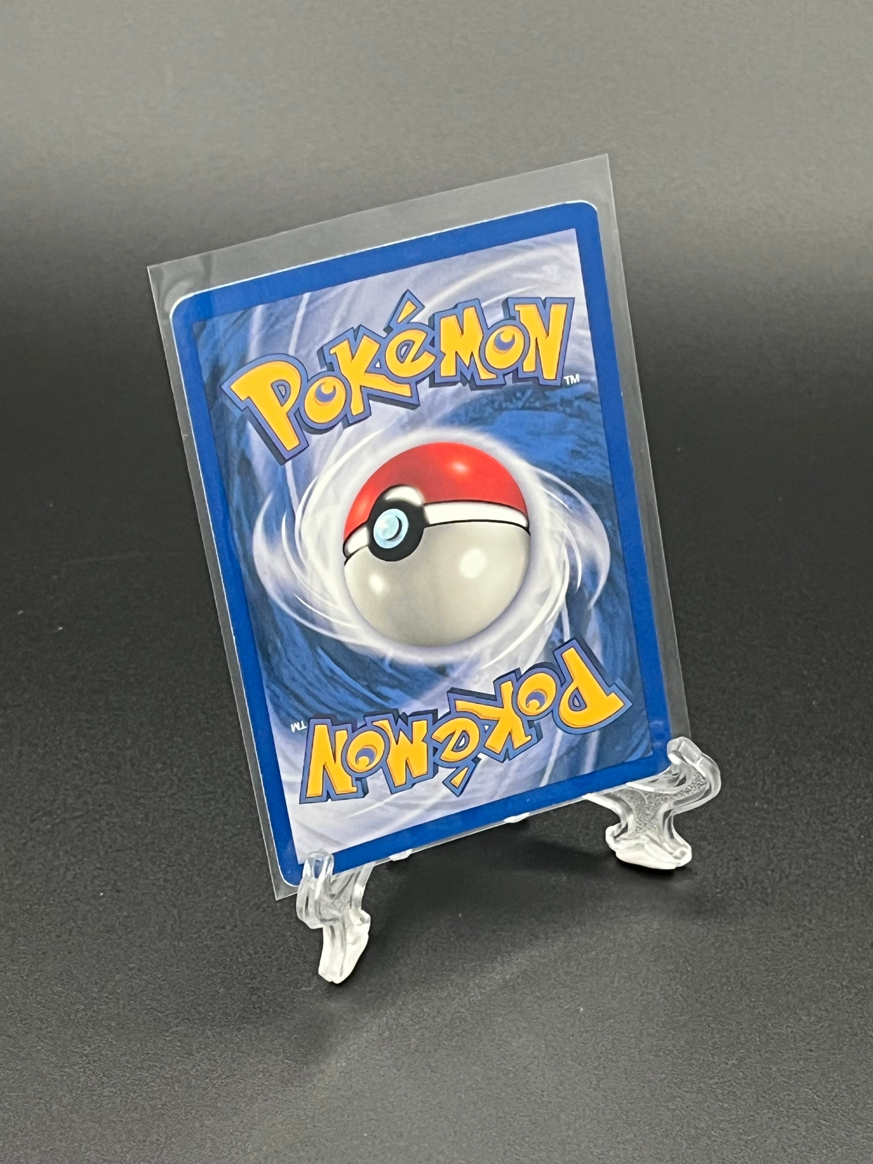 Pokémon trading card in clear protective holder on a dark background