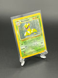 Victeemon trading card in a clear protective holder on a dark background
