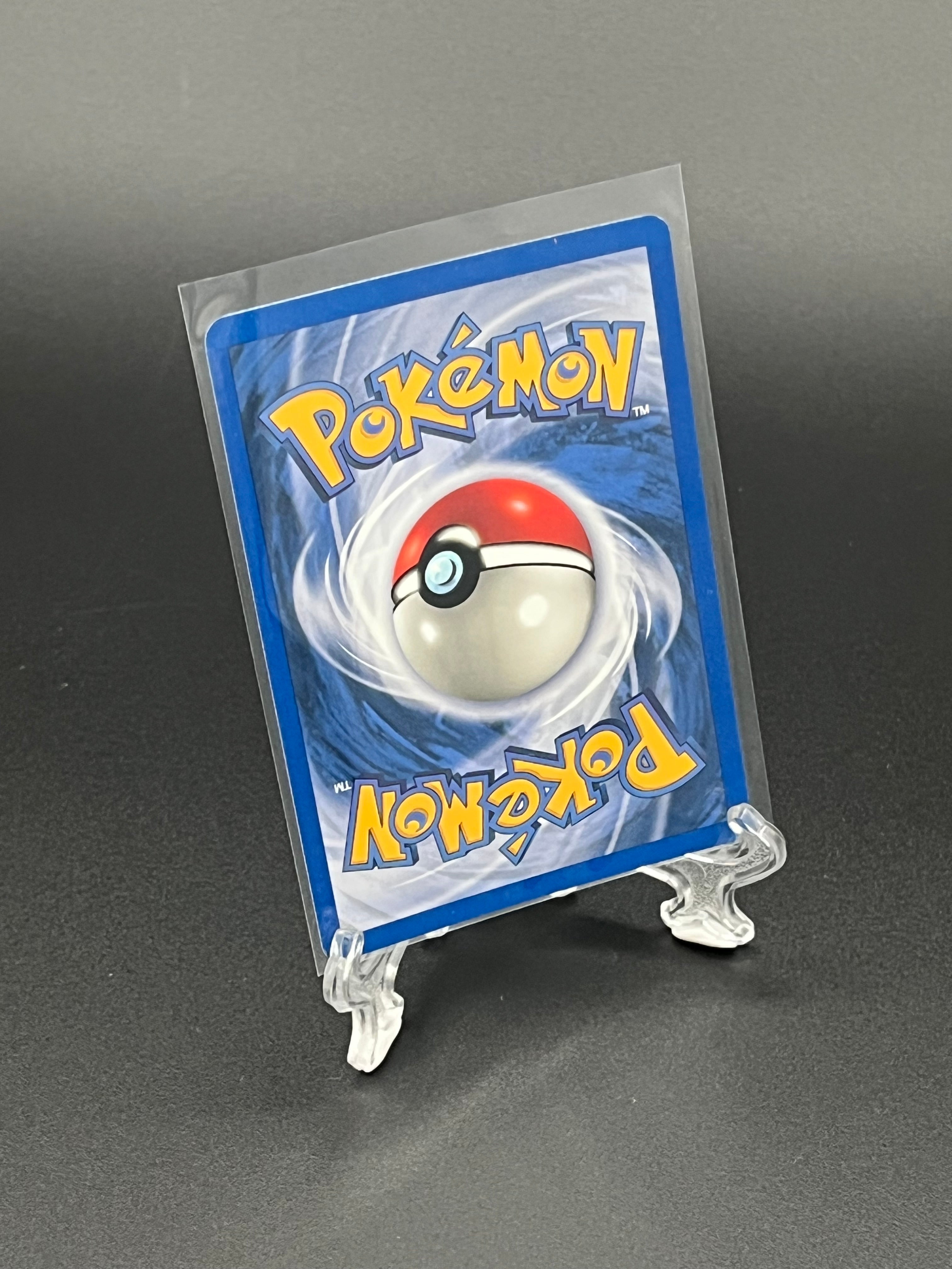 Pokémon trading card in clear protective holder on a dark background