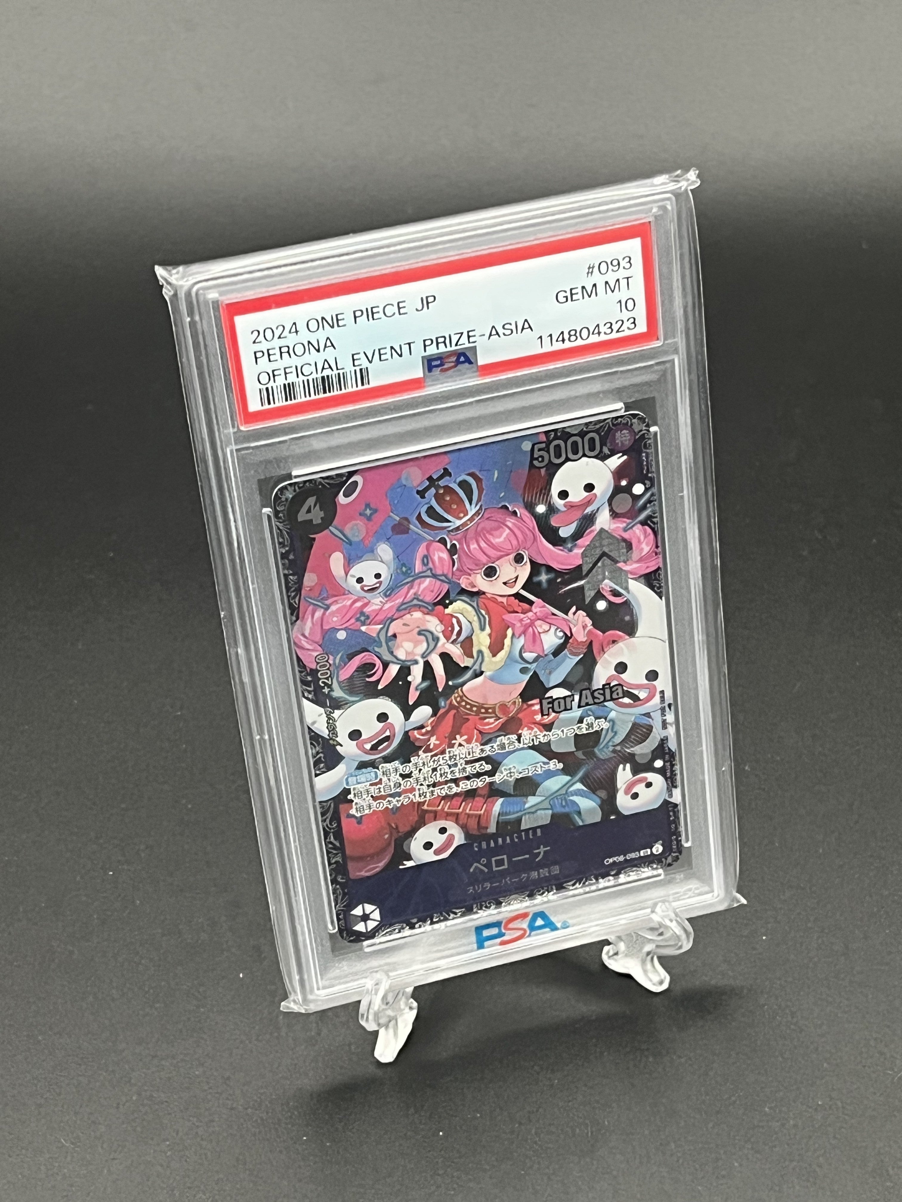 Trading card in a protective case on a gray background