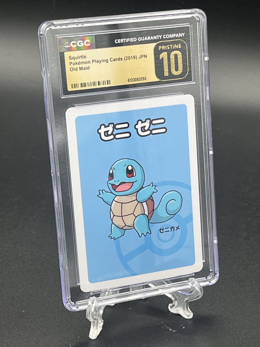 A graded Squirtle Pokémon playing card in a clear CGC PSA holder, displayed on a small clear stand against a dark background. The card has a light blue background with a blue Squirtle illustration and a black/gold CGC label at the top.