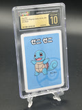 A graded Squirtle Pokémon playing card in a clear CGC PSA holder, displayed on a small clear stand against a dark background. The card has a light blue background with a blue Squirtle illustration and a black/gold CGC label at the top.