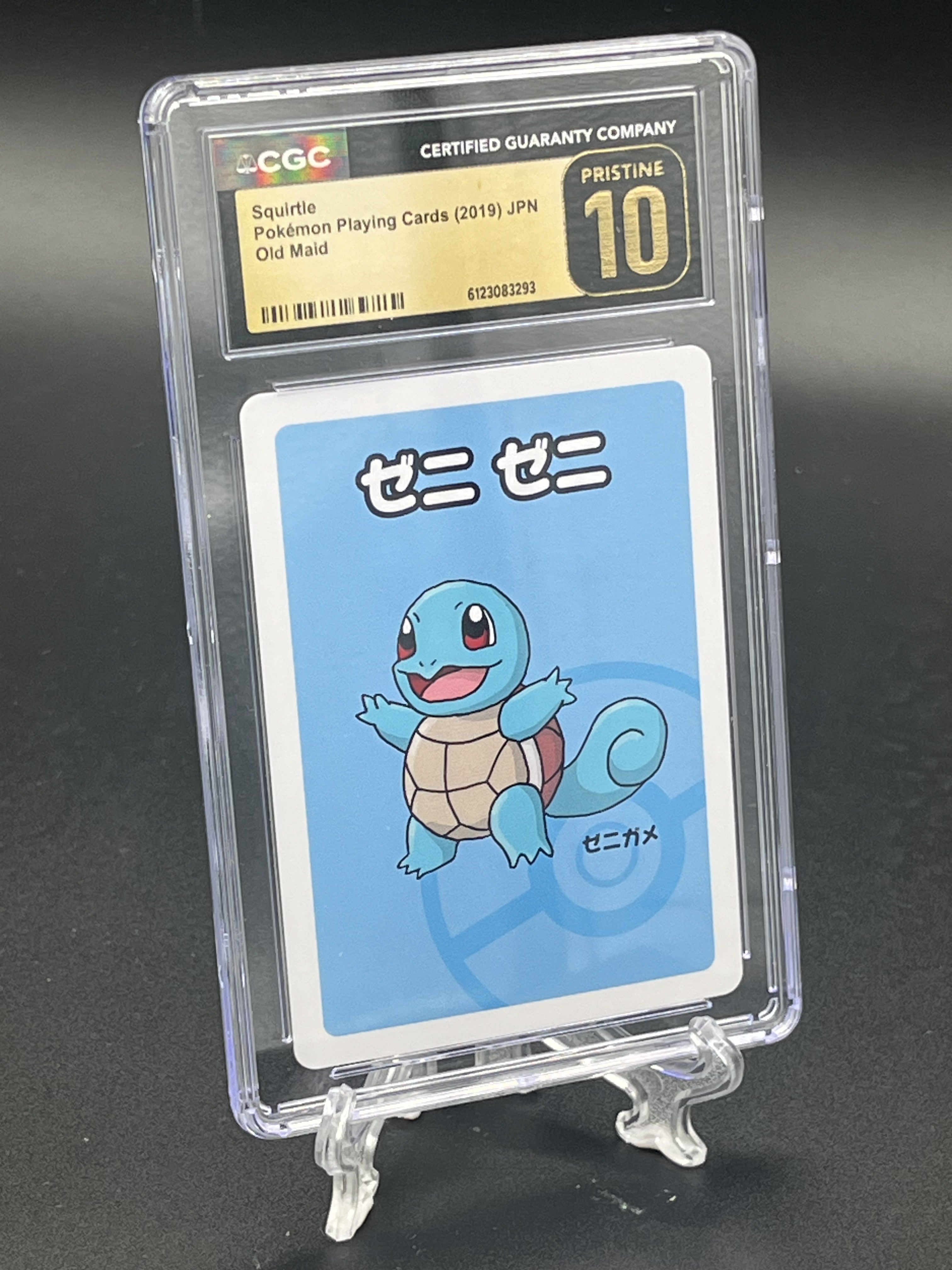 A graded Squirtle Pokémon playing card in a clear CGC PSA holder, displayed on a small clear stand against a dark background. The card has a light blue background with a blue Squirtle illustration and a black/gold CGC label at the top.