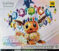 Pokémon trading card game box with Eevee design and colorful gemstones on a white background.